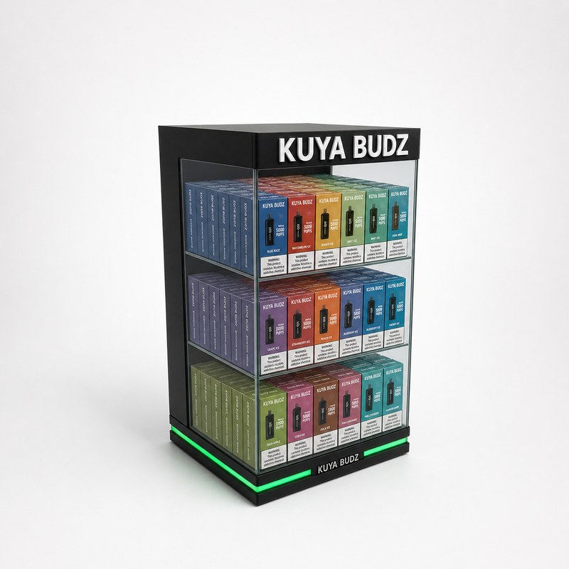 Stocked black and clear acrylic vape cabinet with three shelves and green LED base lighting, left front view.
