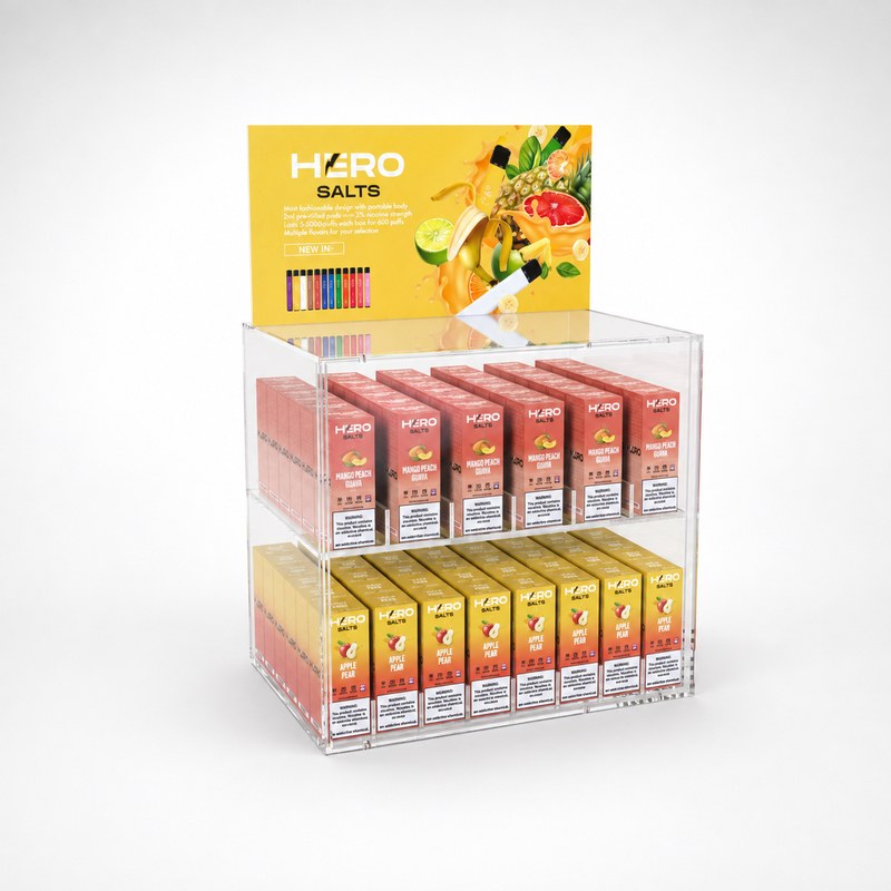 Stocked clear acrylic two-tier countertop vape display with a printed header, left front view.
